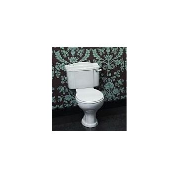 The Shires Abbey Close-Coupled Toilet features a classic design that complements a variety of bathroom styles. It includes a standard close toilet seat and cover, ensuring a comfortable and functional addition to your bathroom suite. The toilet provides r